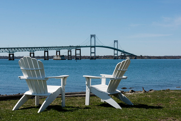 Patio chairs on the U.S. Naval War College campus overlooking the Narragansett Bay and Pell Bridge.