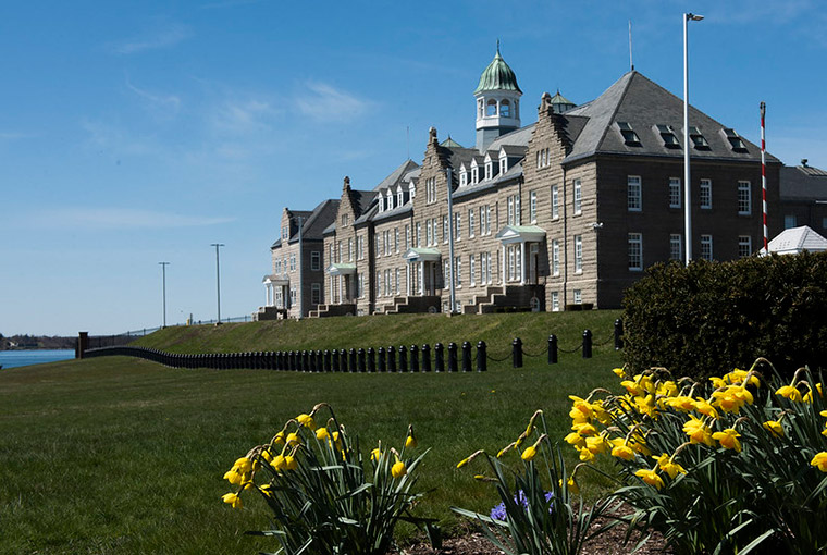 U.S. Naval War College with yellow flowers in spring.