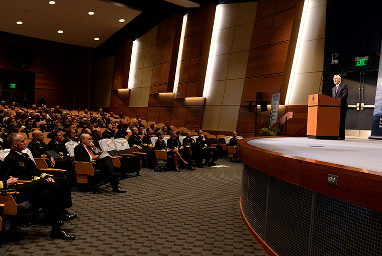 Faculty, staff, and students in U.S. Naval War College Auditorium.