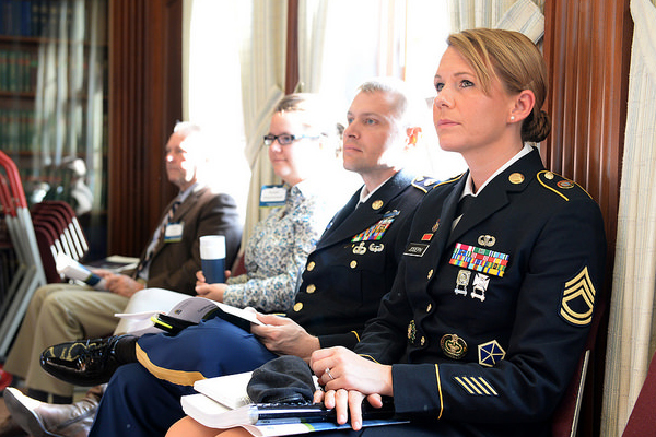 Sgt. 1st Class Tera Vandenheuvel-Joseph, assigned to U.S. Pacific Command in Honolulu, Hawaii, listens to remarks from Adm. Michelle Howard, Vice Chief of Naval Operations, during the 2015 Women, Peace and Security conference at U.S. Naval War College in Newport, Rhode Island.