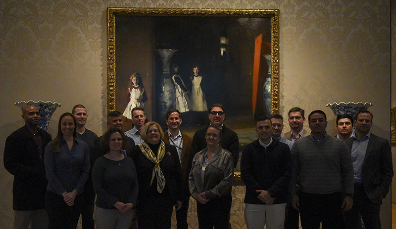 A group of U.S. Naval War College (NWC) students gather at the Boston Museum of Fine Arts for an informative tour of artwork.