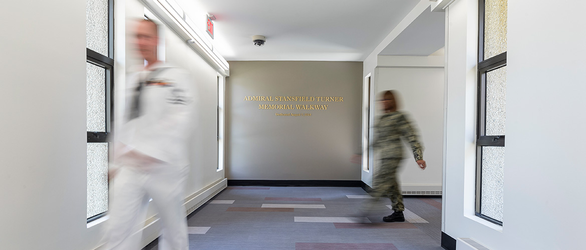 Students walking down hallway at U.S. Naval War College
