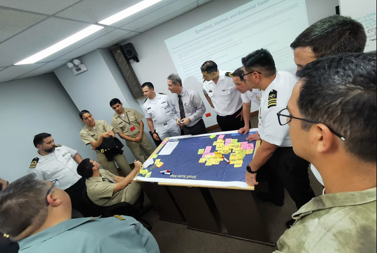 Partner nation junior officers work through a maritime planning scenario at the first-ever U.S. 4th Fleet Maritime Planning Symposium at the Peruvian Naval War College in Callao, Nov. 16, 2023.