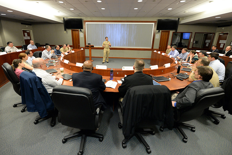 Cmdr. Joe Root, assigned to U.S. Pacific Command (USPACOM), speaks with participants of a Counter-Unmanned Undersea Vehicle (CUUV) capabilities workshop held at U.S. Naval War College in Newport, Rhode Island. 