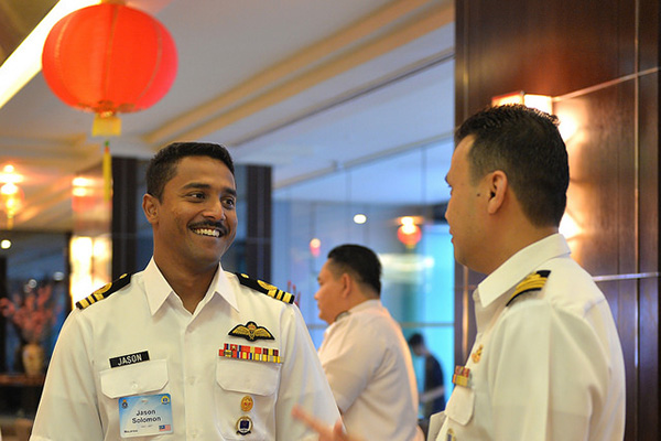 Participants engage in conversation during a concession break at U.S. Naval War College’s 16th Regional Alumni Symposium held in the Malaysian capital of Kuala Lumpur.