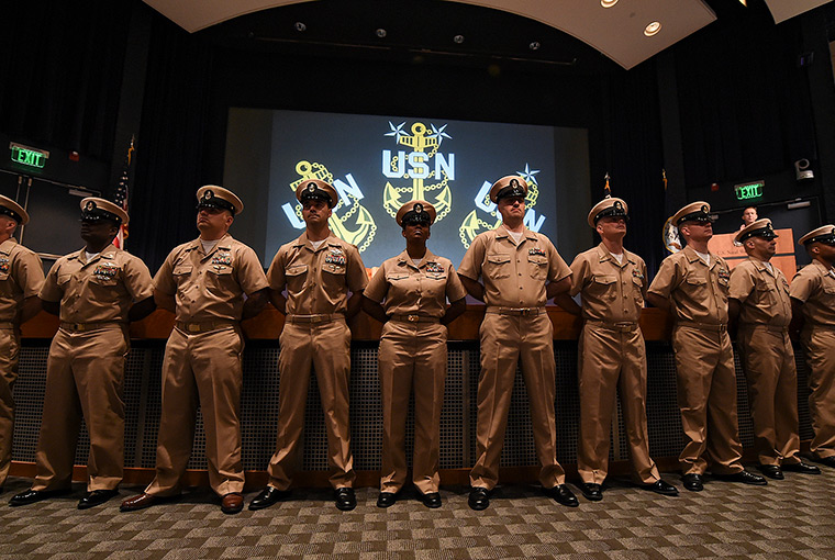 Eleven newly promoted chief petty officers are presented during a pinning ceremony held at U.S. Naval War College.