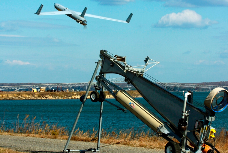 Naval Surface Warfare Center Dahlgren Division (NSWCDD) engineers launch a Scan Eagle unmanned aerial vehicle at the Potomac River Test Range. 