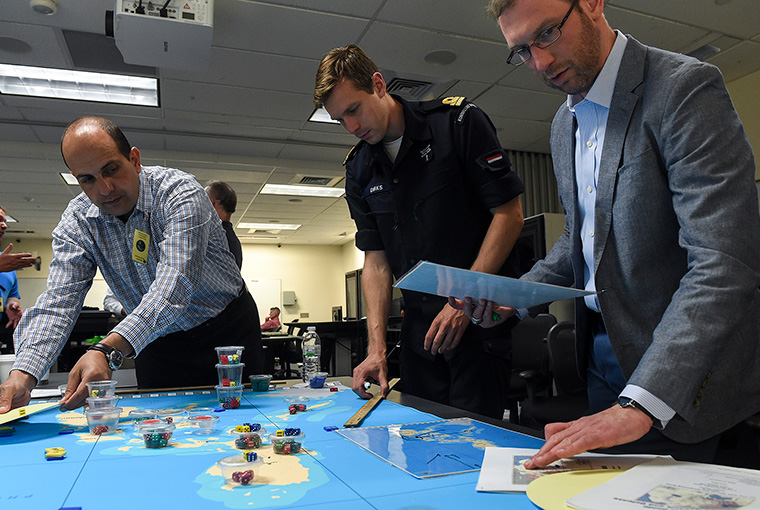 Military officers from various countries participate in the first international wargaming course held at U.S. Naval War College.