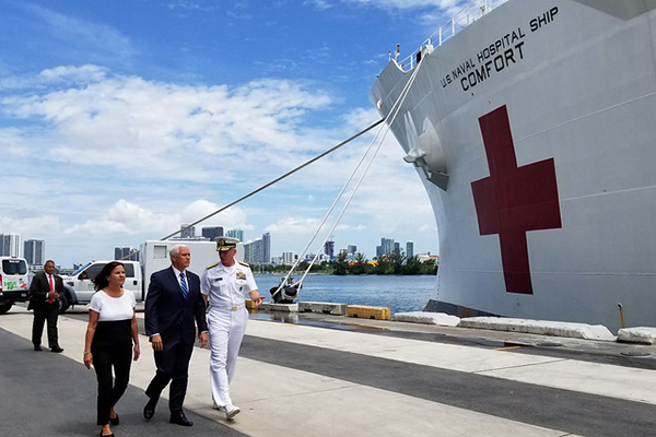 Vice President Mike Pence, center, second lady Karen Pence, and Adm. Craig S. Faller, commander of U.S. Southern Command, visit the hospital ship USNS Comfort (T-AH 20).
