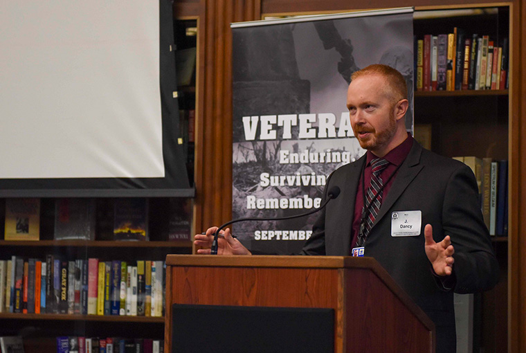 J. Ross Dancy, assistant professor, U.S. Naval War College (NWC), delivers opening remarks for the conference “Veterans: Enduring, Surviving, and Remembering War,” at NWC on Sept. 12.