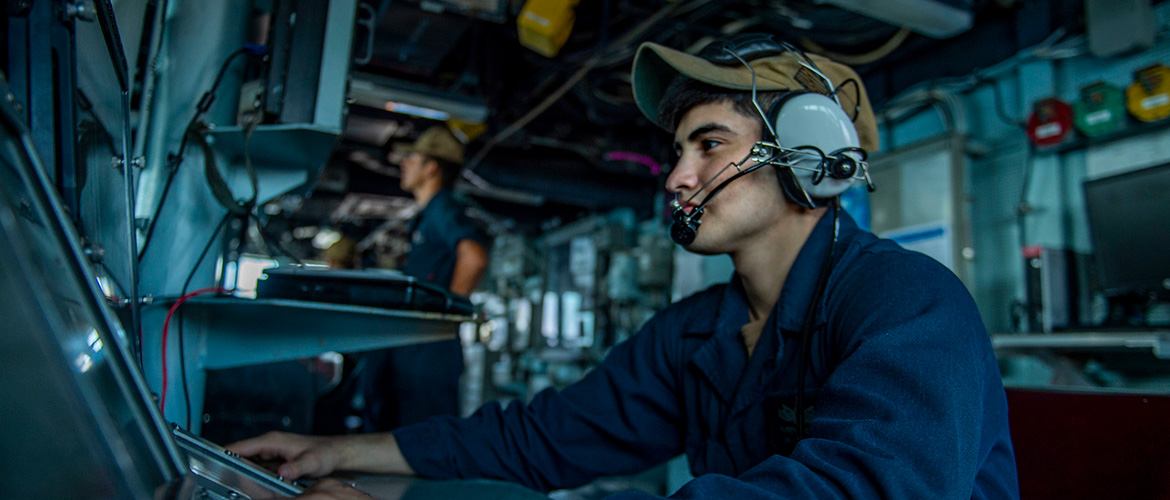 Operations Specialist Seaman Apprentice Reuben Aguilar mans a bridge watch aboard the guided-missile destroyer USS Bainbridge.