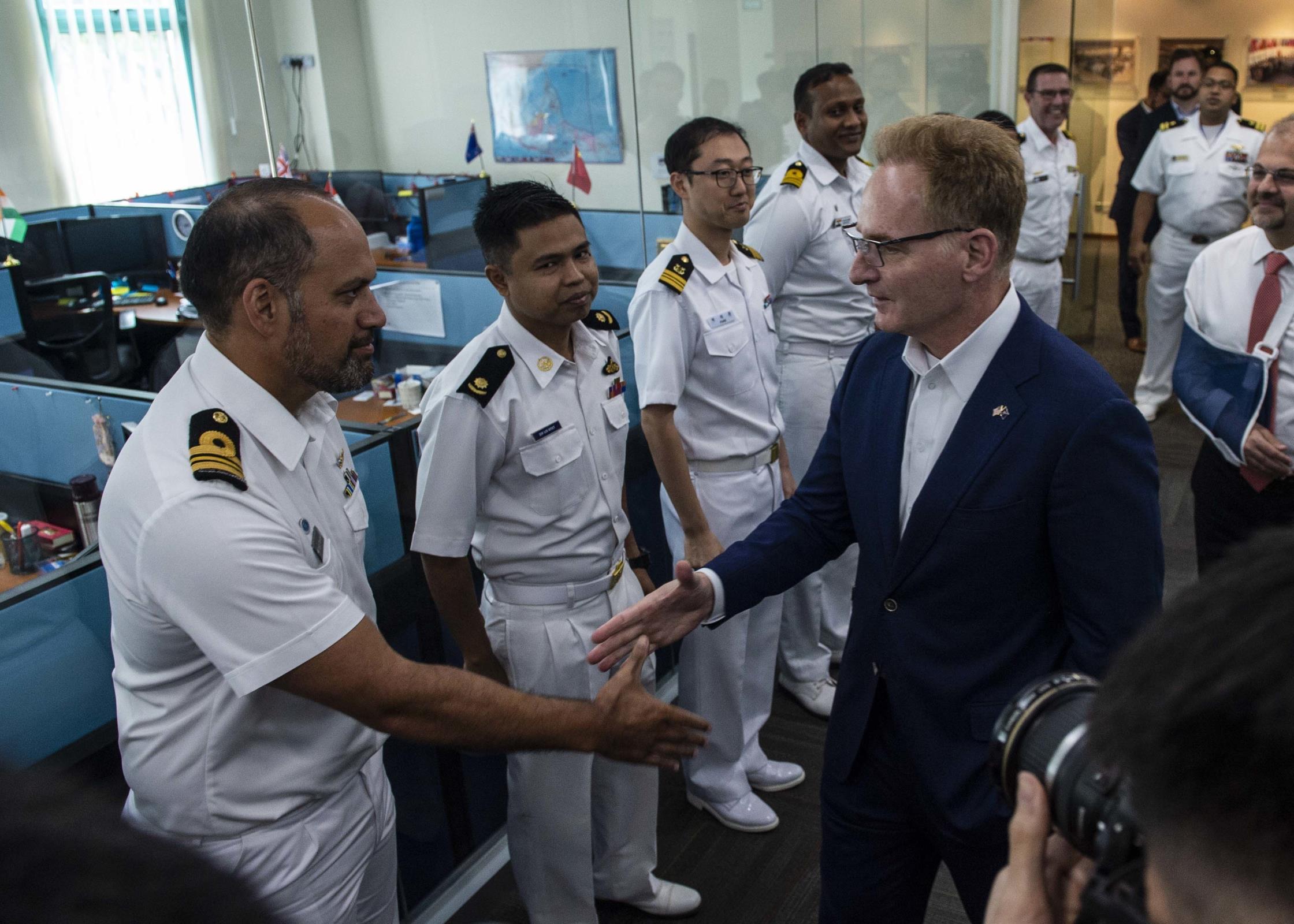 CHANGI NAVAL BASE, Singapore (Jan. 14, 2019) Acting Secretary of the Navy Thomas B. Modly meets with international liaison officers during a tour of the Information Fusion Centre. Modly’s visit to Singapore is part of a multination visit to the U.S. Indo-Pacific areas of responsibility focused on reinforcing existing partnerships and visiting Sailors and Marines providing forward presence. (U.S. Navy photo by Mass Communication Specialist 2nd Class Christopher Veloicaza/Released)200114-N-FV739-037