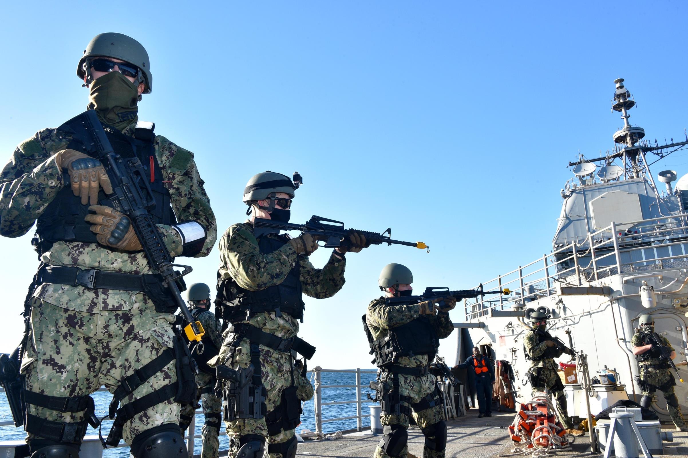 GULF OF OMAN (Jan. 11, 2021) Sailors assigned to the guided-missile destroyer John Paul Jones (DDG 53) conduct a visit, board, search and seizure drill aboard the guided-missile cruiser USS Philippine Sea (CG 58) in the Gulf of Oman, Jan. 11, 2021. (U.S. Navy photo by Mass Communication Specialist 2nd Class Indra Beaufort) 210111-N-IE405-1204 