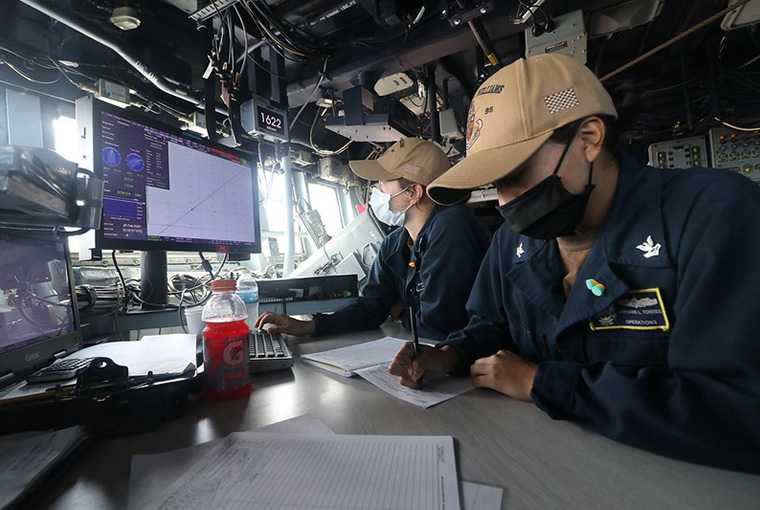 Quartermaster 3rd Class Makayla Roney and Quartermaster 2nd Class Stephanie Torres stand quartermaster of the watch aboard the Arleigh Burke-class guided-missile destroyer USS James E. Williams (DDG 95) during a replenishment-at-sea with the Henry J. Kaiser-class fleet replenishment oiler USNS John Lenthall (T-AO 189), Feb. 25 2021.
