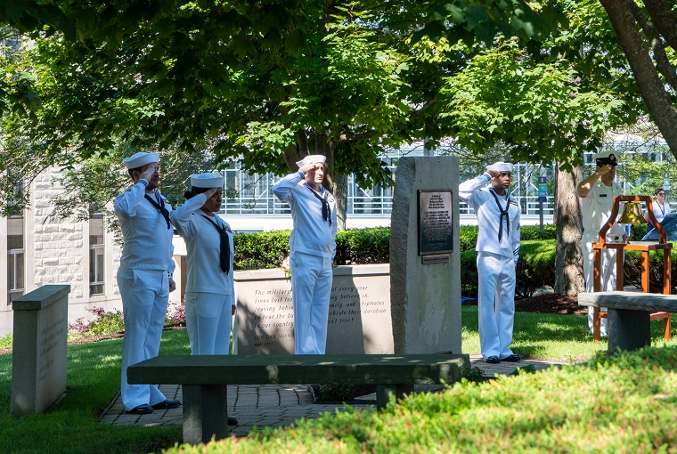 Participants from the U.S. Naval War College (NWC) pay respect during a ceremony to commemorate the 20th anniversary of the 9/11 attacks.