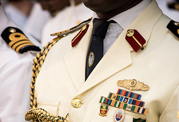 International students standing during graduation.