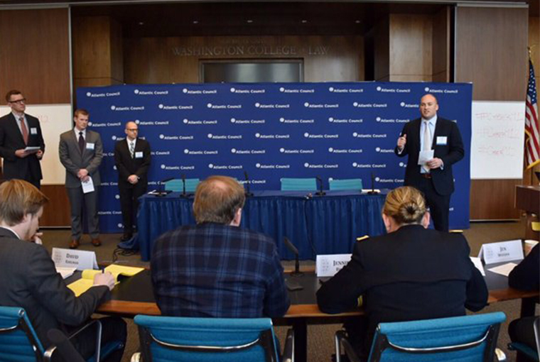A team comprised of U.S. Naval War College (NWC) students present to a panel of judges at the Cyber 9/12 Student Challenge competition held over three days at American University’s Washington College of Law in Washington, D.C. The team won the competition after beating out 48 college teams from 32 schools from around the world.