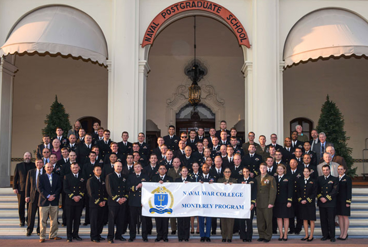 The 73rd graduating class of the U.S. Naval War College Monterey Joint Professional Military Education program poses for a class photo on the steps of Naval Postgraduate School’s Herrmann Hall.