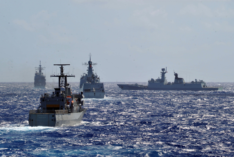 Photo of U.S. Navy Ticonderoga-class guided missile cruiser USS Port Royal (CG 73), the Mexican Navy patrol-vessel ARM Revolution (P 164), the People’s Liberation Army (Navy) frigate Yueyang (FF 575) and destroyer PLA(N) Haikou (DD 171) move into a multi-ship formation during Rim of the Pacific (RIMPAC) Exercise 2014. 