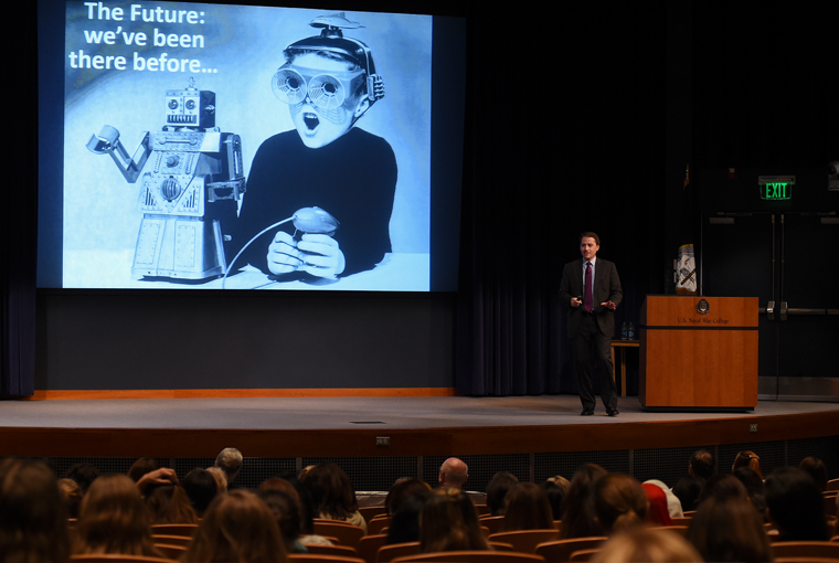 Tim Shultz, associate dean of academics, U.S. Naval War College’s (NWC) Electives and Research Department, gives a presentation titled, “Future Warfighting” during a spouses lecture held at NWC.