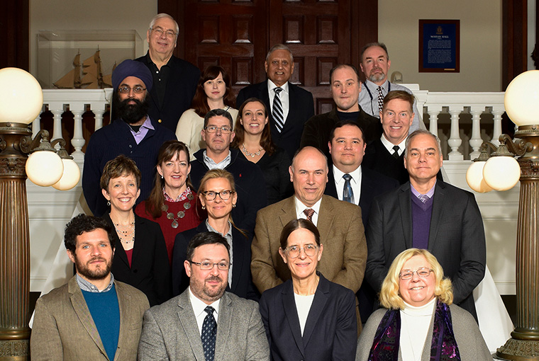 Members of the newly created U.S. Naval War College advisory faculty senate gathered in front of the college’s Mahan Rotunda.