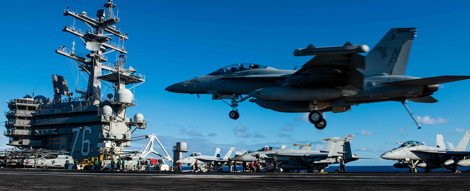 An EA-18G Growler assigned to Electronic Attack Squadron (VFA) 141 lands on the flight deck of the Navy's forward-deployed aircraft carrier, USS Ronald Reagan (CVN 76). Ronald Reagan, the flagship of Carrier Strike Group 5, provides a combat-ready force that protects and defends the collective maritime interests of its allies and partners in the Indo-Pacific region.