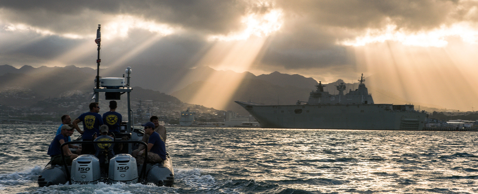 Navy divers assigned to Mobile Diving and Salvage Unit (MDSU) 1, transit to the USS Arizona Memorial for a dive during the 2018 Rim of the Pacific (RIMPAC) exercise, July 7, 2018.
